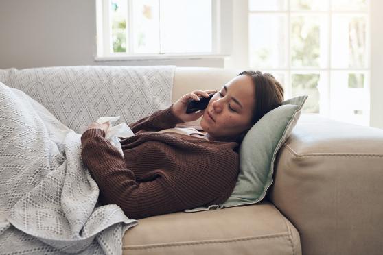 Woman laying on couch